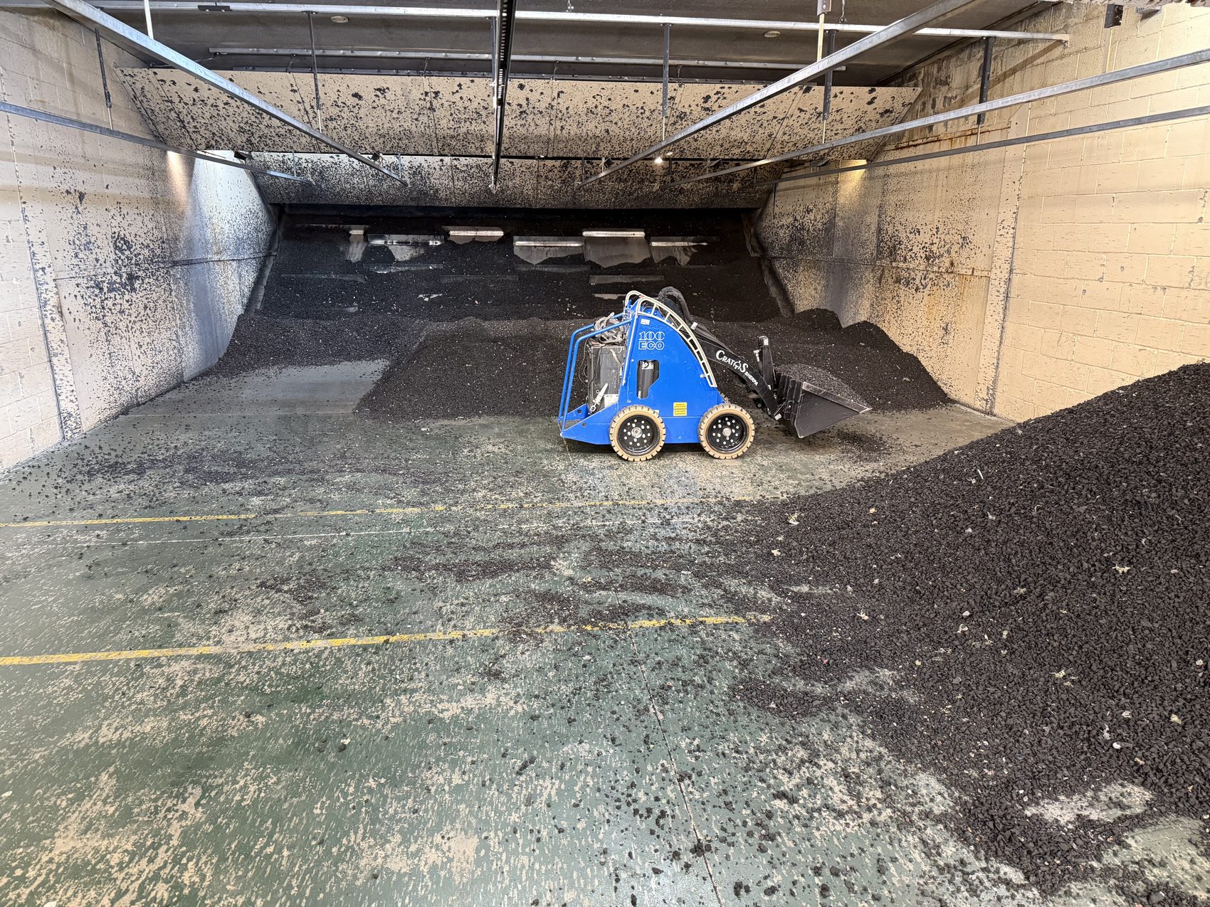 Range media being worked down inside an indoor bay